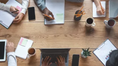Employees working at a table