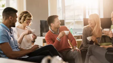 Six colleagues discussing in a conference room