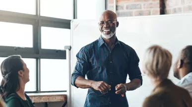 A person giving a presentation in front of their colleagues