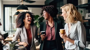 women laughing in office