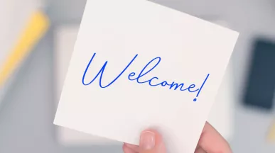 An image that shows a sticky note that says "Welcome!"