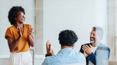 Team celebrating around a table