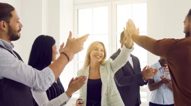 Employees high fiving