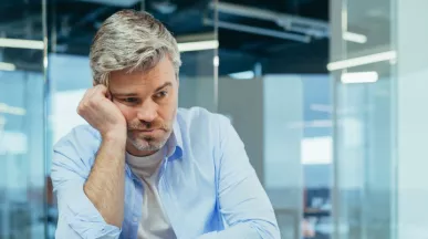 Sad worker disengaged at work due to a toxic work culture