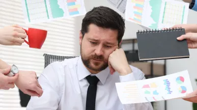 An overwhelmed, disengaged employee trying to manage all on their to-do list.