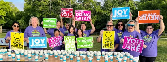 holding encouraging signs