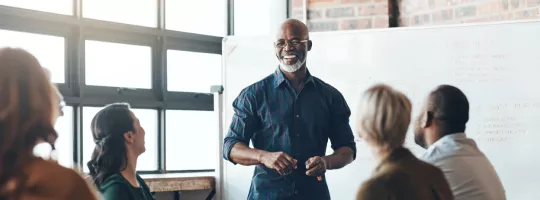 A person giving a presentation in front of their colleagues