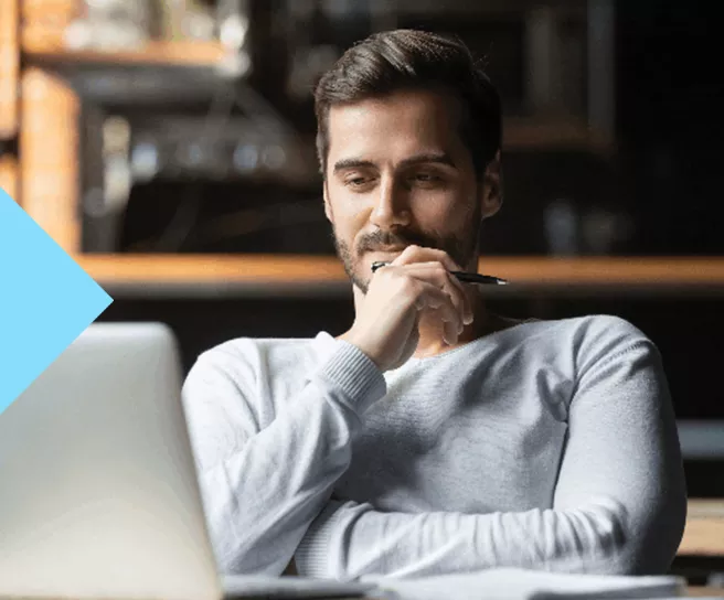 man looking at computer