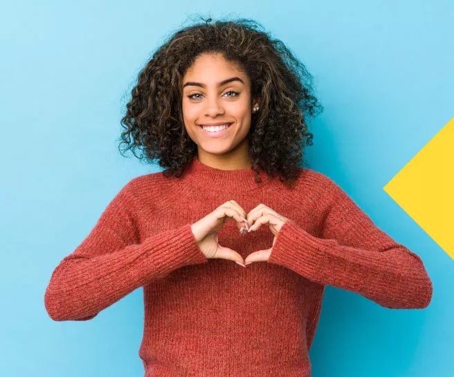 A person making a heart with their hand