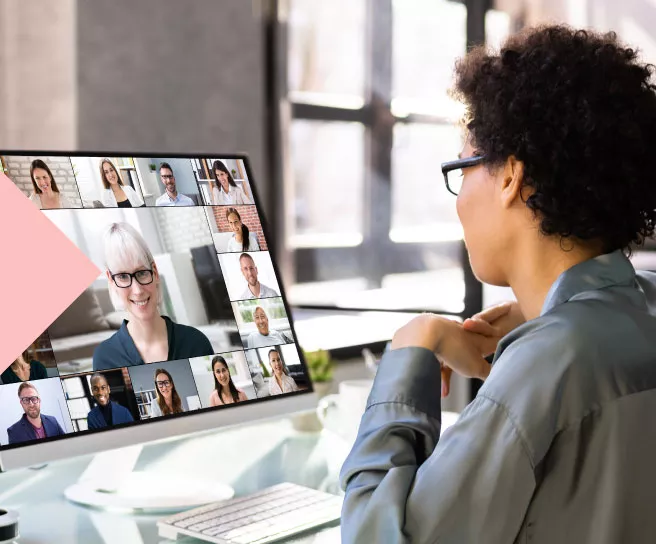 Employee on a virtual conference call looking at their computer